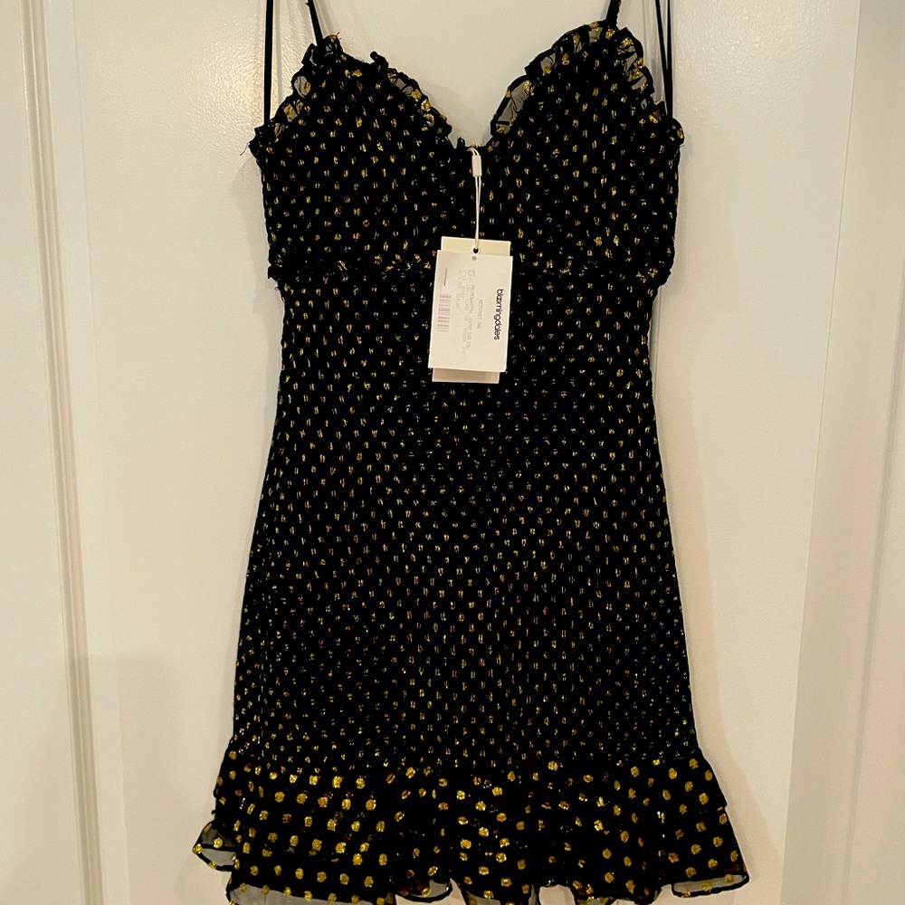 Likely new with tags black and gold shimmering mini dress size 2